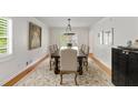 Formal dining room with a large table, elegant chairs, and sophisticated decor at 5040 Winding Branch Dr, Dunwoody, GA 30338