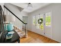 Elegant foyer with hardwood floors, staircase, and decorative details at 5040 Winding Branch Dr, Dunwoody, GA 30338