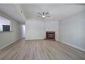 Open living room with modern floors, fireplace, and neutral color scheme at 2528 Mulberry Rock Rd, Dallas, GA 30157