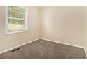 Cozy bedroom offers plush carpeting, neutral walls, and bright natural light at 3693 Larkspur Ter, Decatur, GA 30032