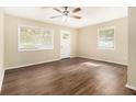 Bright living room featuring gleaming hardwood floors, neutral paint, and natural light at 3693 Larkspur Ter, Decatur, GA 30032