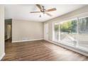 Inviting living room featuring hardwood floors and large windows that brighten the space with natural light at 474 Waterford Nw Rd, Atlanta, GA 30318