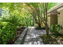 Charming front entrance with a stone walkway, lush greenery, and well-maintained landscaping at 2620 Margaret Mitchell Dr, Atlanta, GA 30327