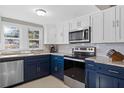 Modern kitchen featuring stainless steel appliances, granite countertops and tiled backsplash at 3595 South Nw St, Duluth, GA 30096