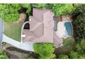 Aerial view of a luxurious home with a private pool and lush greenery at 770 Pine Leaf Ct, Alpharetta, GA 30022
