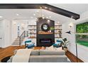 Stylish living room featuring a modern fireplace, sleek shelving, and lots of natural light at 3456 Thornewood Dr, Atlanta, GA 30340