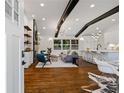Open-concept living room features hardwood floors, modern lighting, and a sleek design at 3456 Thornewood Dr, Atlanta, GA 30340