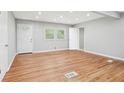 Bright living room featuring hardwood floors, recessed lighting, and multiple windows at 2450 Elkhorn Dr, Decatur, GA 30034