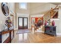 Grand foyer with hardwood floors, a staircase, and a view into the formal dining room at 4802 Moon Chase Dr, Buford, GA 30519