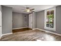 The living room features wood floors, a ceiling fan, and natural light at 1290 Campbellton Sw Rd, Atlanta, GA 30310