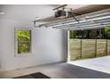 Spacious garage with an open door, showcasing ample storage and access to the property's exterior at 888 Old Tucker Rd, Stone Mountain, GA 30087