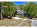 Charming two-story home with lush landscaping, a well-maintained lawn, and classic architectural details at 402 Glenhurst Trce, Canton, GA 30115