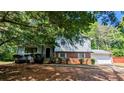 Charming two-story home featuring a brick facade, light siding, and a covered front entrance at 4402 Sebring Walk, Decatur, GA 30034