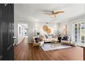 Inviting living room with hardwood floors, neutral decor, and a view into the hallway at 1150 Collier Nw Rd # E3, Atlanta, GA 30318