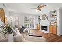 Cozy living room boasts a fireplace, built-in shelving, and access to the outdoor area at 1150 Collier Nw Rd # E3, Atlanta, GA 30318