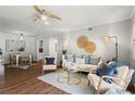 Comfortable living area with a ceiling fan, stylish furniture, and adjacent dining space at 1150 Collier Nw Rd # E3, Atlanta, GA 30318