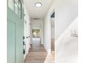 Bright hallway with hardwood flooring and a view to the back yard at 1783 Big Valley Ln, Stone Mountain, GA 30083