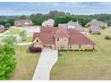 An aerial view captures the house's location among other homes and mature trees at 401 Sara Ct, Loganville, GA 30052