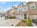 Attractive townhome with a two-car garage, a cozy entrance, and well-manicured landscaping for curb appeal at 6304 Brookwater Vw, Mableton, GA 30126