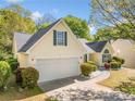 Attractive home with a two-car garage, manicured shrubs, and a well-maintained lawn at 823 Langley View Ct, Loganville, GA 30052