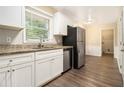 Modern kitchen featuring stainless steel appliances, granite countertops, and white cabinetry at 3500 Finesse Dr, Decatur, GA 30032