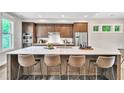 Modern kitchen features stainless steel appliances, an island with seating, and ample cabinet space at 215 Arizona Ne Ave # 6, Atlanta, GA 30307