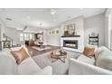 Open-concept living space features a cozy fireplace and flows seamlessly into the dining and kitchen areas at 215 Arizona Ne Ave # 6, Atlanta, GA 30307