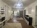 Stylish living room featuring tile floors, modern lighting, and neutral decor offering a welcoming ambiance at 1379 Pair Sw Rd, Marietta, GA 30008