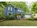 Beautiful two-story home with blue siding, white trim, and a well-manicured front lawn at 2317 Danielle Ct, Marietta, GA 30062