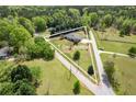 Spacious 1+ acre property showcasing the home's location amidst a lush, green landscape and neighboring roads at 220 Pitts Chapel Rd, Newborn, GA 30056