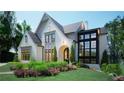 A beautiful rendering of the front exterior of a brick home, highlighting landscaping and architectural details at 469 Emily Reed Ln, Atlanta, GA 30342