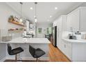 Bright kitchen featuring modern appliances, a breakfast bar, and plenty of storage at 734 Frasier Se Cir, Marietta, GA 30060
