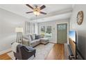 Cozy living area featuring hardwood floors, a ceiling fan, and a front door at 734 Frasier Se Cir, Marietta, GA 30060