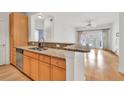 Well-lit kitchen featuring granite countertops, stainless steel appliances, and an island with sink at 799 Hammond Dr # 314, Atlanta, GA 30328