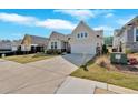Attractive one-story home boasting neutral siding, stone details, a well-maintained lawn, and a two-car garage at 127 Laurel Farms Ln, Dallas, GA 30157