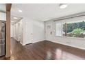 Bright living room featuring hardwood floors and a large window at 1652 Detroit Nw Ave, Atlanta, GA 30314