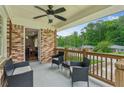 Inviting covered porch with brick accents and comfortable outdoor seating at 1652 Detroit Nw Ave, Atlanta, GA 30314