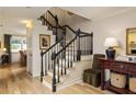 Elegant staircase with wooden steps and black banister at 266 Adair St, Decatur, GA 30030
