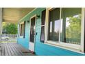 Inviting front porch with stylish windows, black shutters, and outdoor lighting fixtures at 3065 Ashly Pines Dr, Snellville, GA 30078