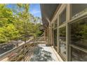 Relaxing balcony area with outdoor views, accessible through sliding glass doors at 1290 Fernwood Ne Cir, Brookhaven, GA 30319