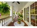 Inviting balcony featuring a ceiling fan, outdoor plants, and views of the surrounding greenery at 4094 Norton Se Pl, Smyrna, GA 30082