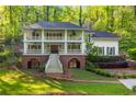 Beautiful two-story home with double porch and landscaped yard in a serene, wooded setting at 4094 Norton Se Pl, Smyrna, GA 30082
