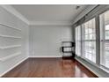 Bright room with hardwood floors, large windows, and stylish shelving at 4280 Azurite St, Cumming, GA 30040