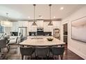 Stylish kitchen with stainless steel appliances, a large island, and modern lighting at 3699 School Street, Chamblee, GA 30341