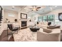 Bright living room featuring a coffered ceiling, fireplace, and neutral decor at 3699 School Street, Chamblee, GA 30341
