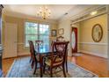 Dining room featuring hardwood floors and chandelier at 2611 Fireside Sw Trl, Conyers, GA 30094