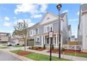 A two-story home boasting a well-kept lawn and beautifully landscaped surroundings, offering a picturesque view at 3003 Clayton St, Woodstock, GA 30188
