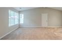 Open living room with vaulted ceilings and lots of natural light at 3897 Mcgill Dr, Decatur, GA 30034
