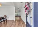 Inviting entryway featuring hardwood floors, neutral walls, and views into the living spaces at 335 Pintail Ct, Suwanee, GA 30024