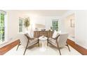 Bright living room with modern furniture, white walls, and large windows at 535 Silver Pine Trl, Roswell, GA 30076